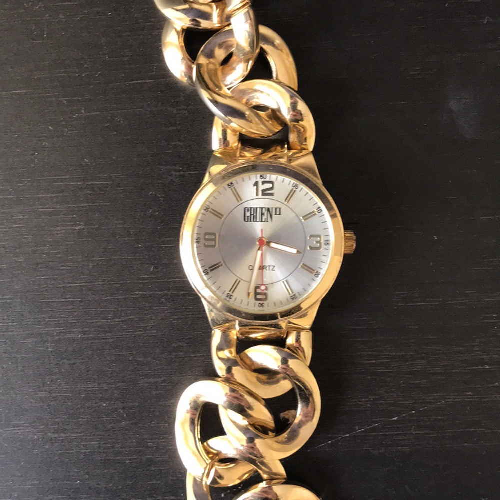 Gold band and blue face silver band men’s watch